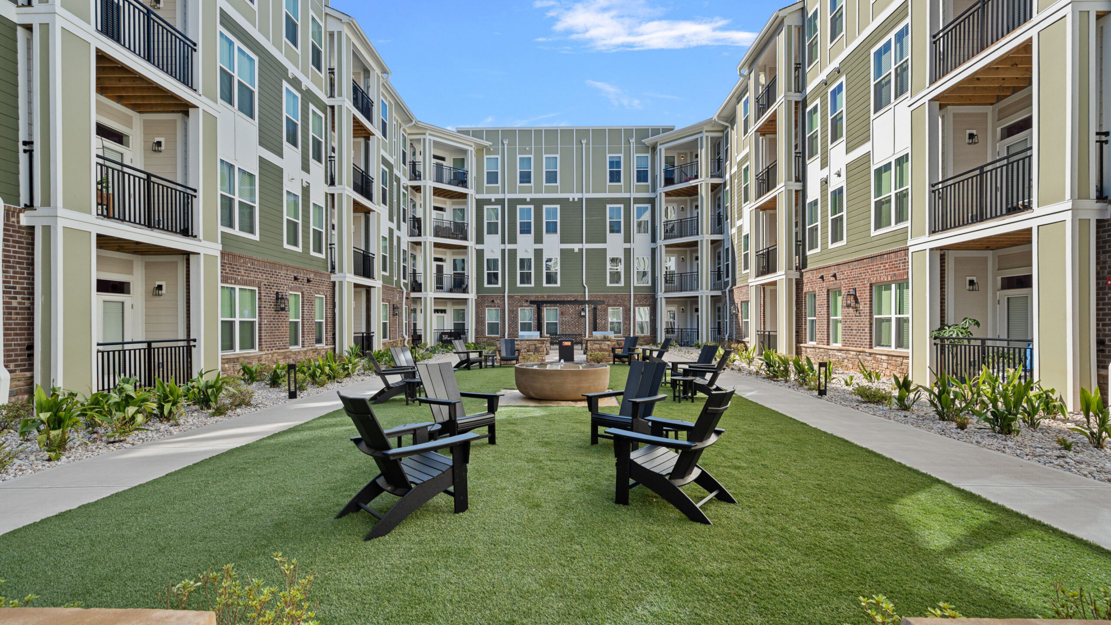 Hawthorne at Traditions beautiful woman buying kale at a farmers market