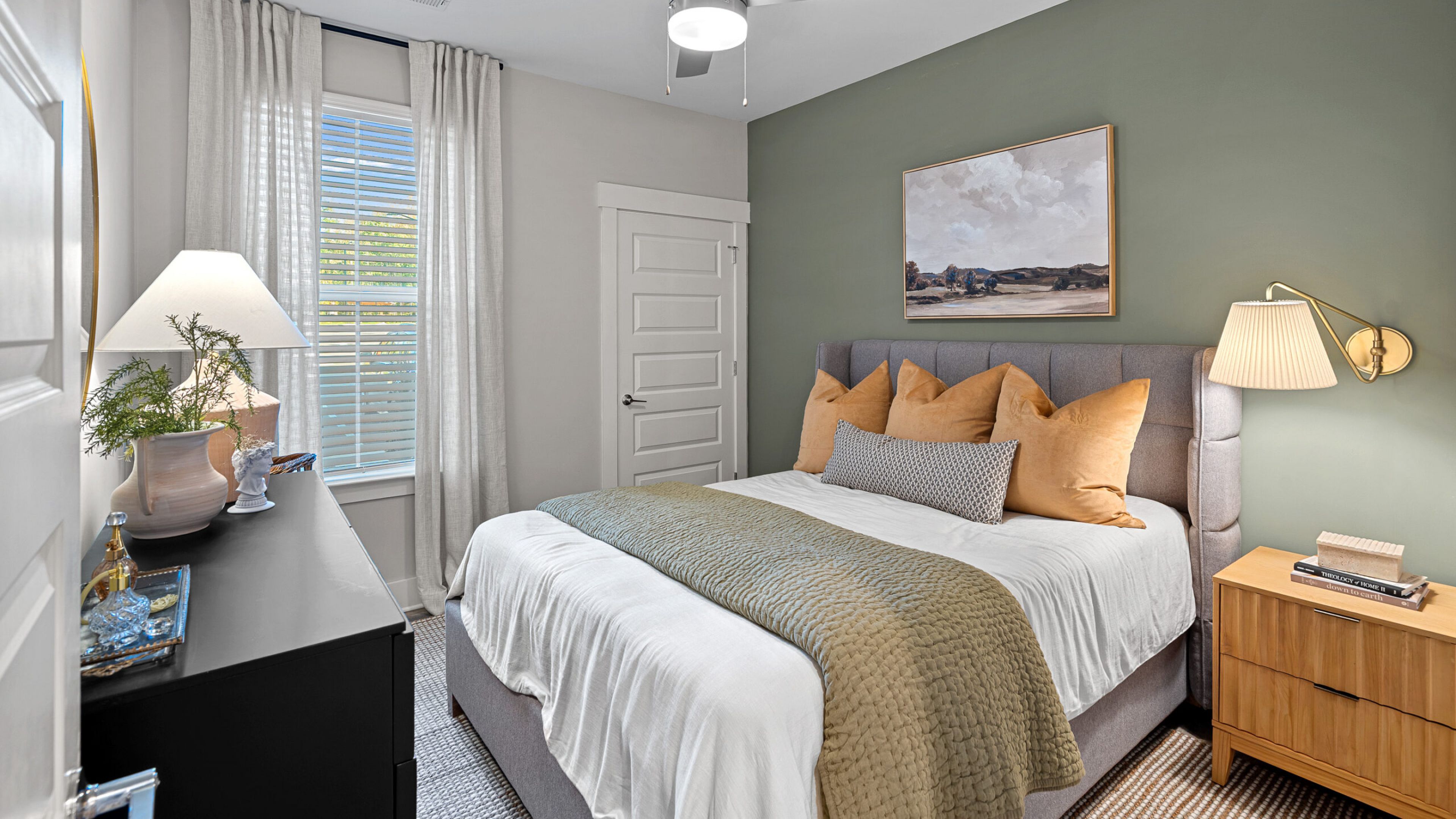 Hawthorne at Traditions luxury apartment kitchen with island, designer tile backsplash, and stainless steel appliances